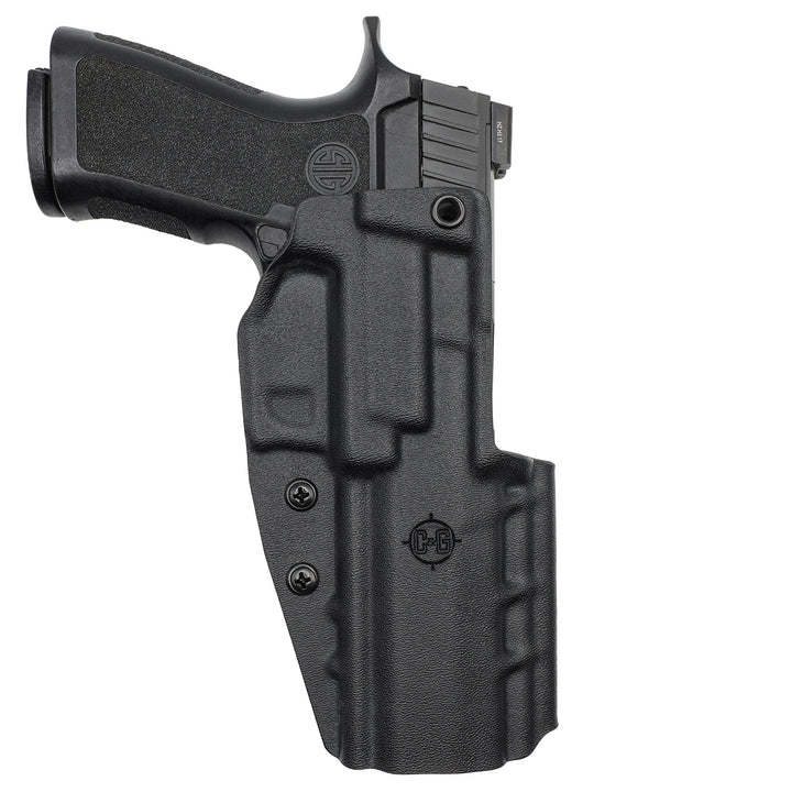 Front view of a black TRINITY holster holding a SIG P320-XFIVE pistol, with the grip extending left.