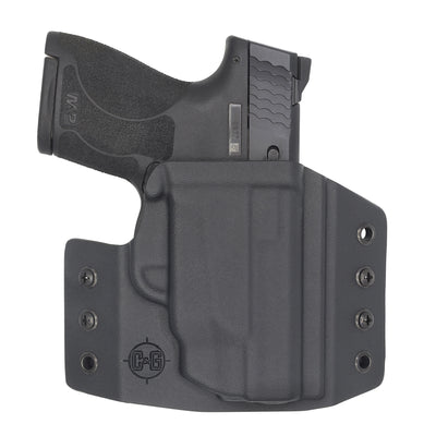 This is the C&G Holsters Covert series (OWB) outside the waistband Holster for the Smith & Wesson M&P Shield with crimson trace laser with the gun in right hand.